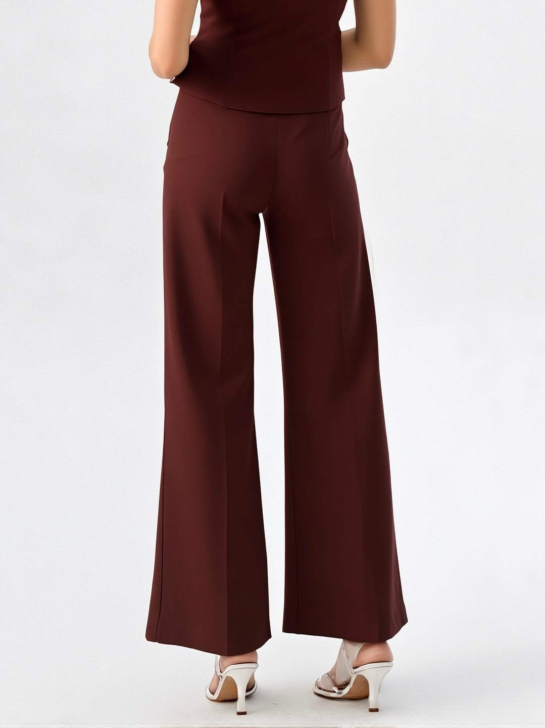 Back view of elegant straight-fit trousers in burgundy, featuring a high waist and structured silhouette.